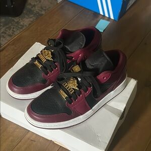 Nike Black and Burgundy Sneakers with Gold Accents